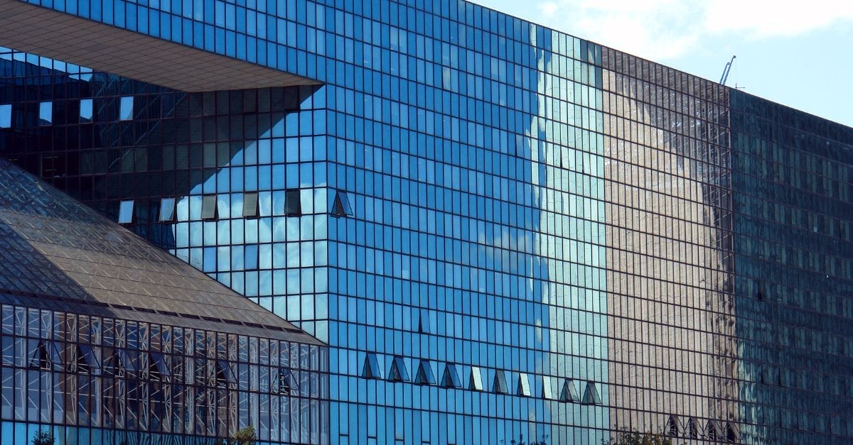 Image of Paris La Défense, glass-windowed building.